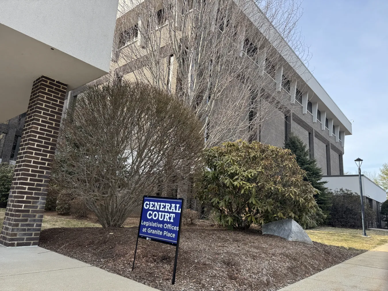 A photo of Granite Place with a sign that reads "GENERAL COURT"