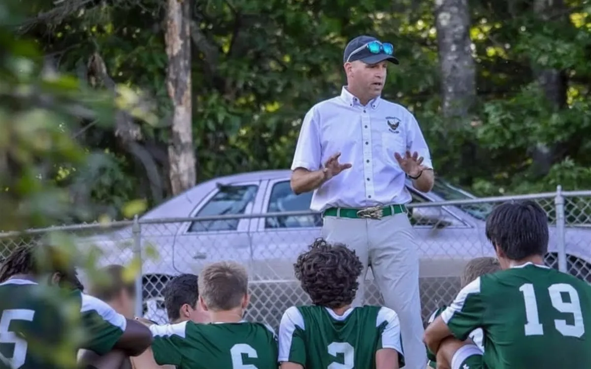Coach Scott Zipke addresses his soccer team