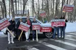 Amherst educators hold signs pushing for a fair contract
