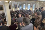 Audience members rise in applause during Governor Ayotte's 2026 State of the State Address after she thanked teachers and support staff for all they do for New Hampshire students.