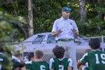 Coach Scott Zipke addresses his soccer team