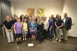 The 2026 New Hampshire delegates to the NEA Representative Assembly pose for a group photo. NEA-NH President stands front and center with a purple tutu and a sash that reads "The queen has retired".