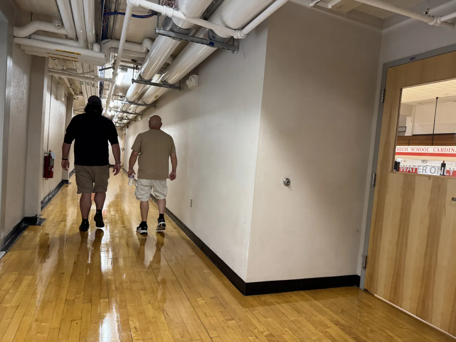 Claremont custodians Troy and Joe walk the halls of Stevens High School