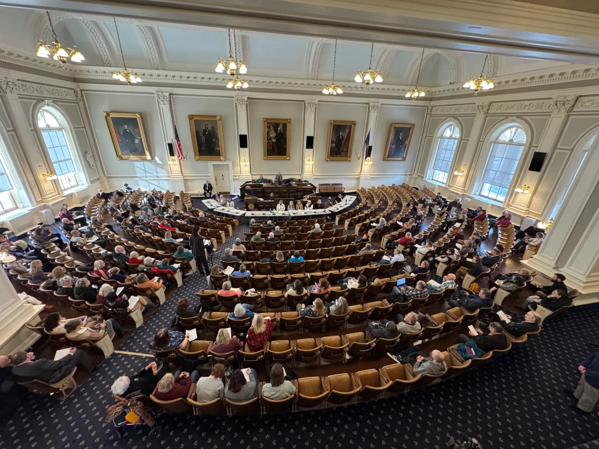 A panoramic photo of the New Hampshire Representatives Hall.