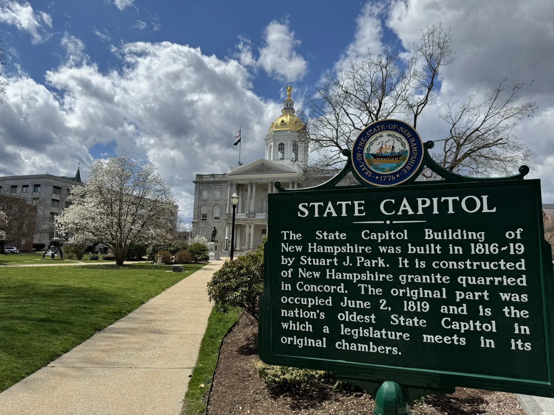 An image of the State Capitol historical placard at the NH State House complex.