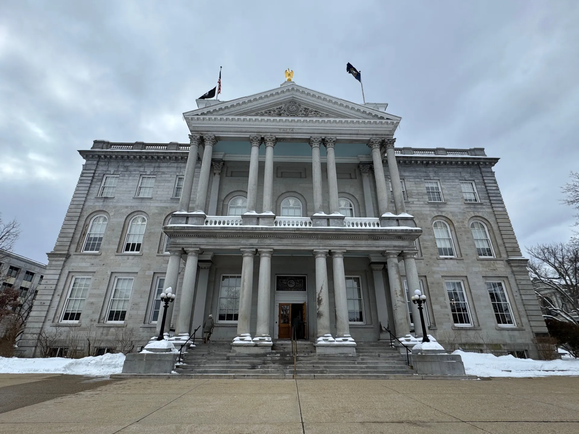 An image of the NH State House in the winter.
